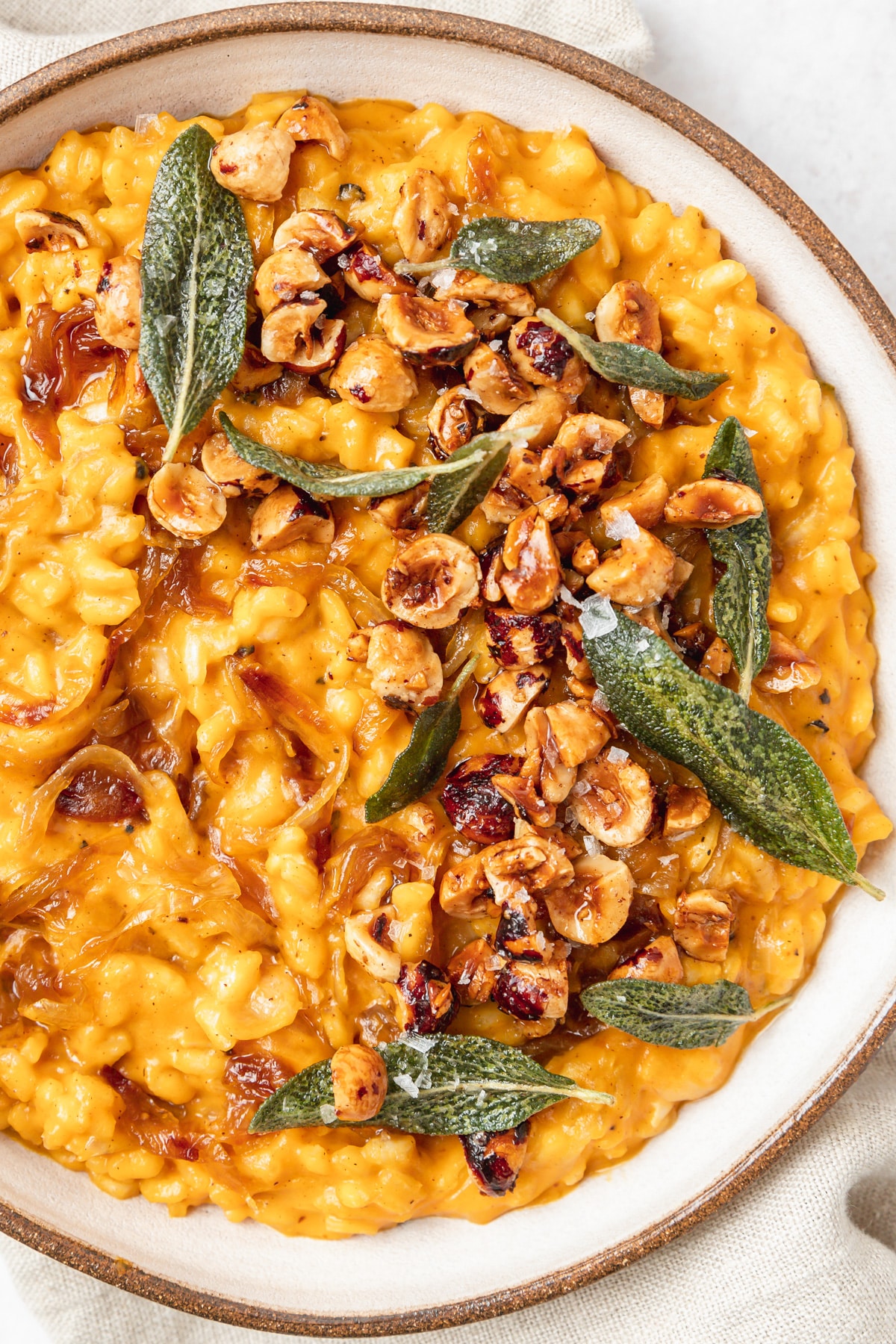 close up shot of pumpkin risotto with crispy sage.