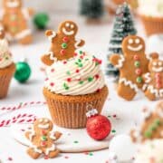 close up shot of gingerbread cupcakes topped with mini gingerbread men.