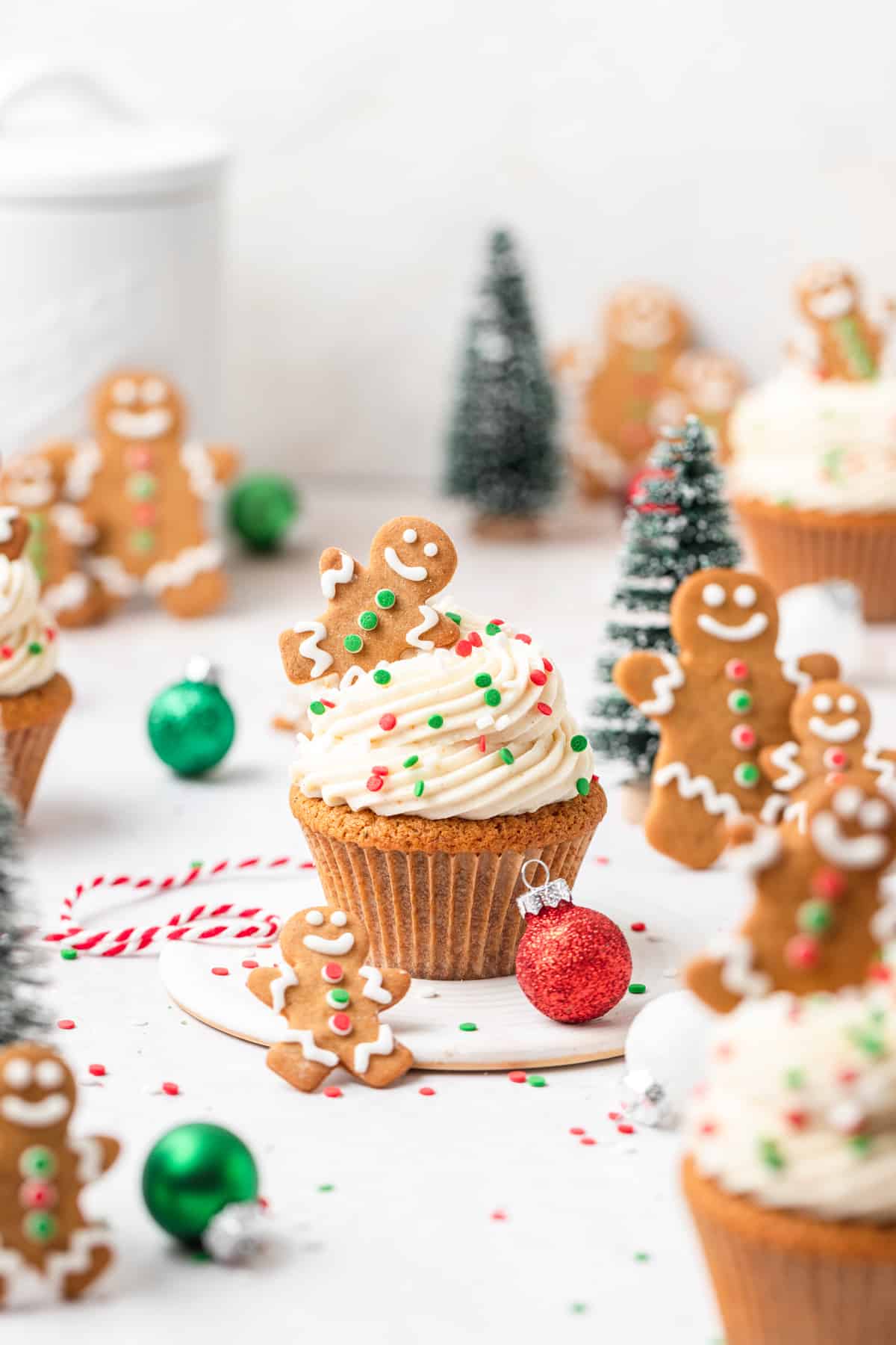 brown butter gingerbread cupcakes topped with cream cheese frosting.