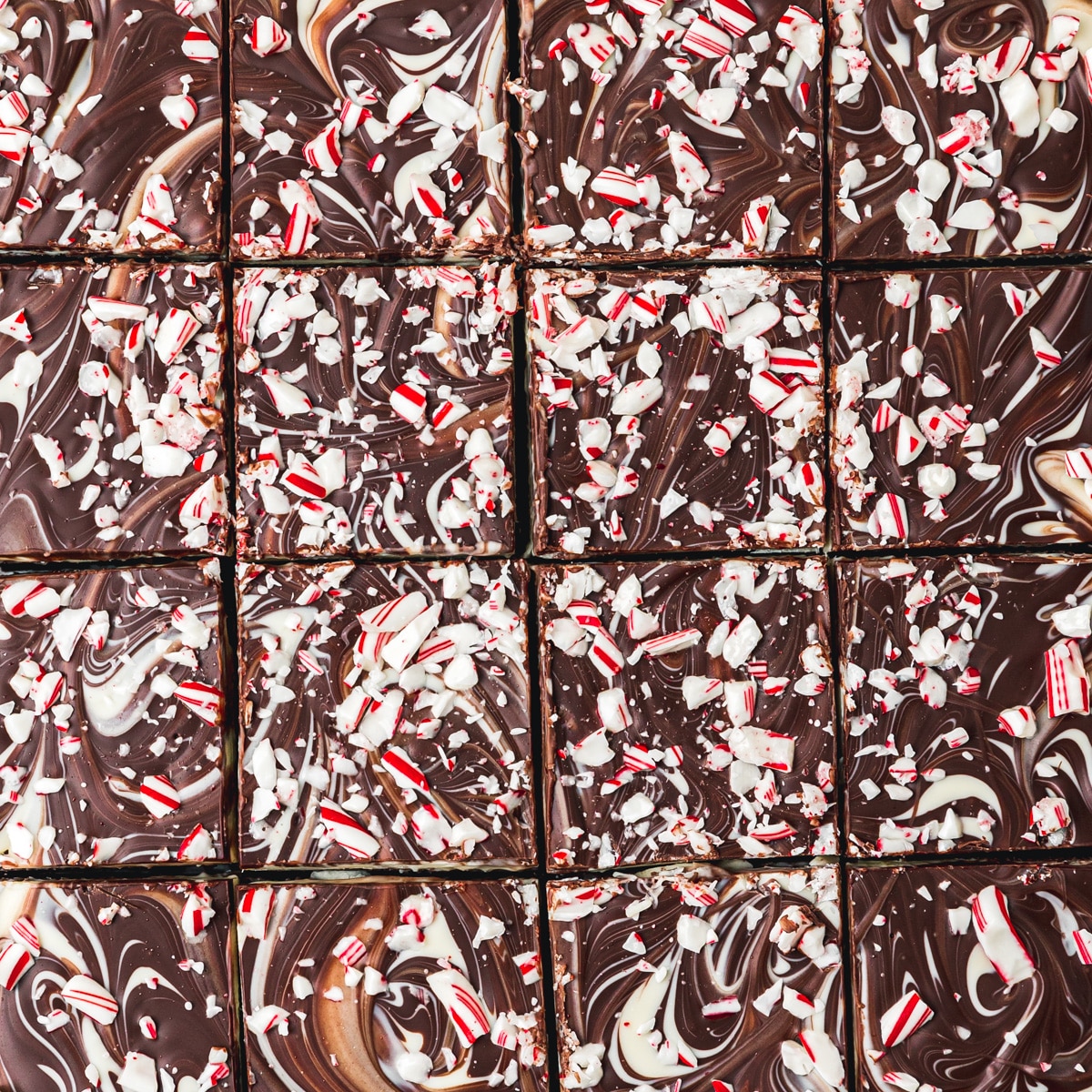 dark chocolate peppermint bark brownies cut into squares.
