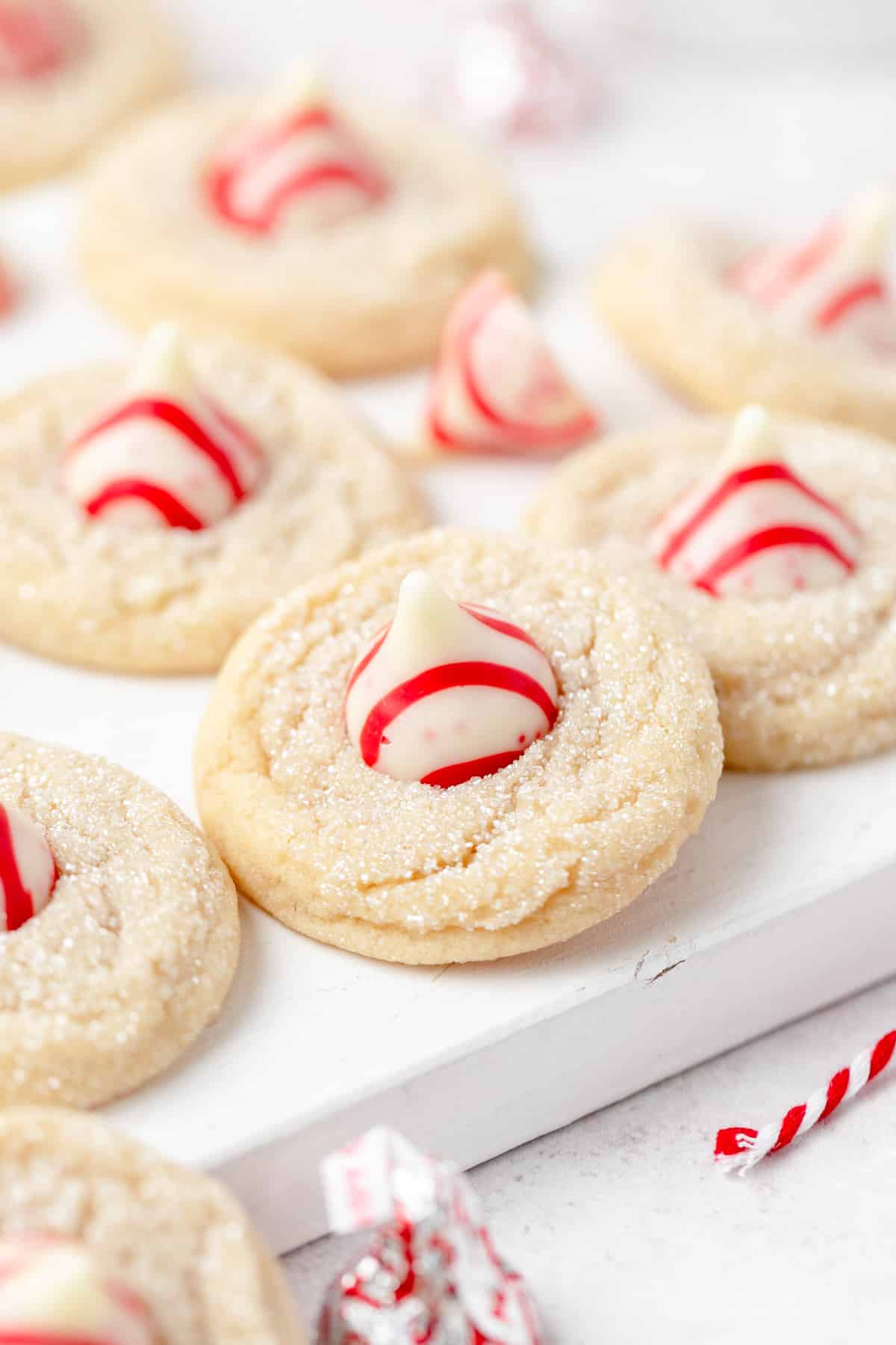 peppermint kiss cookies with white chocolate peppermint kisses on top.