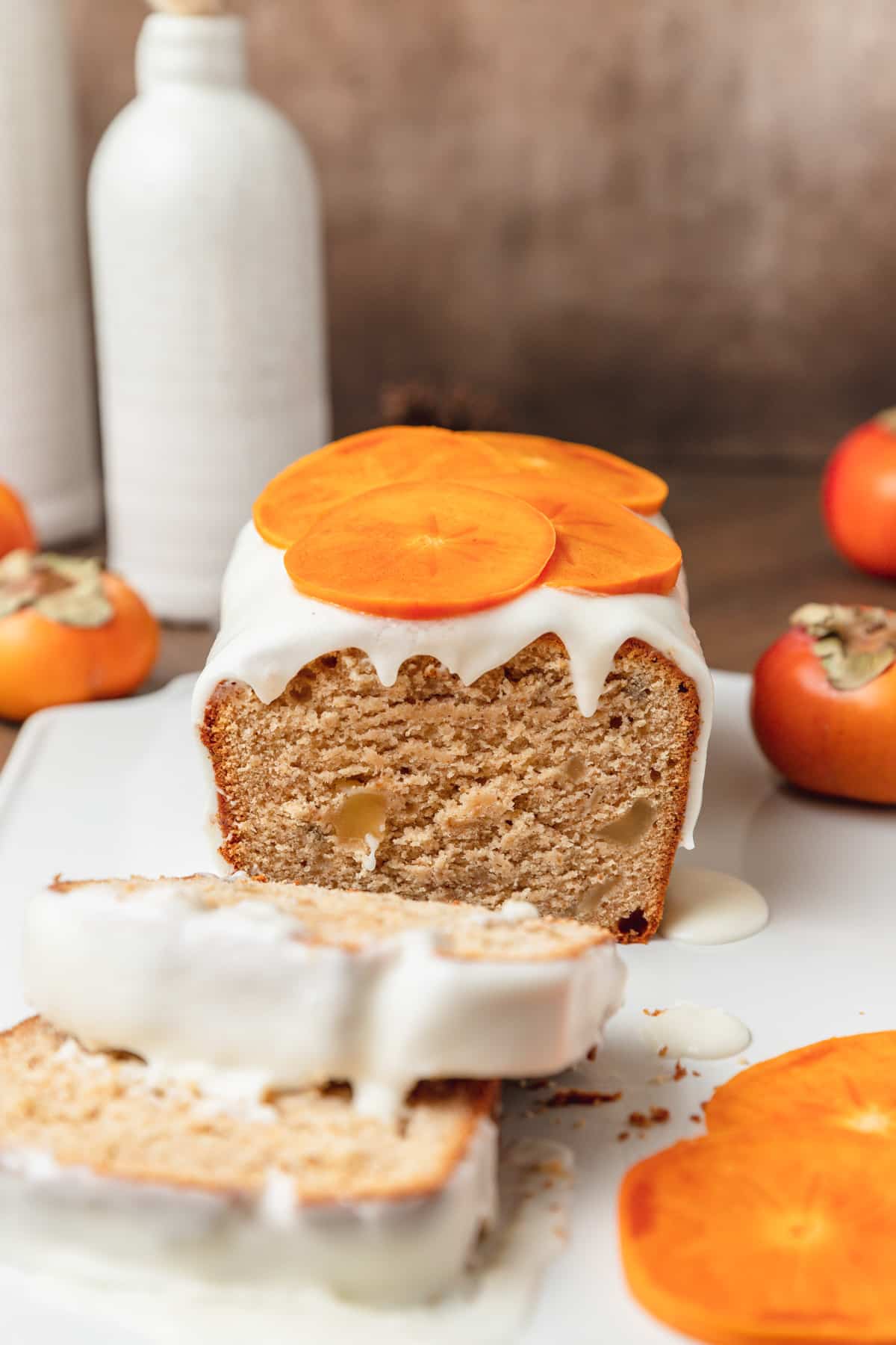 persimmon loaf cake with candied ginger and simple glaze.