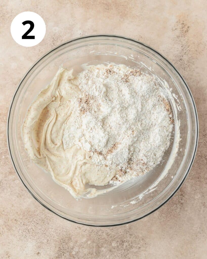 adding hazelnut flour to cookie dough.