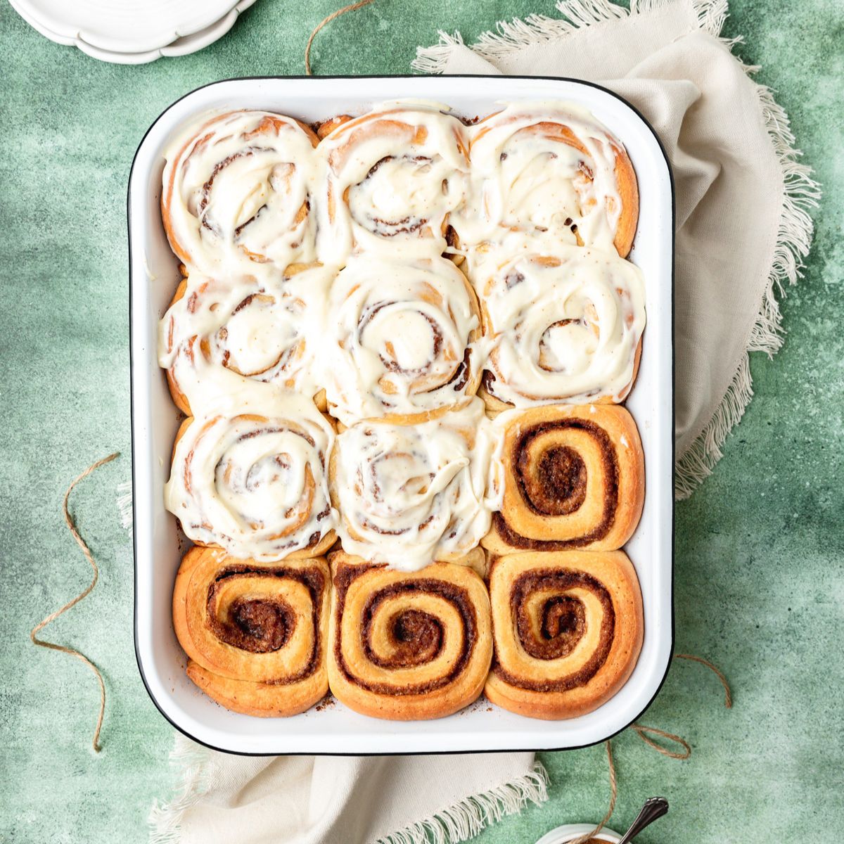 close up shot of tray of brown butter eggnog cinnamon rolls.