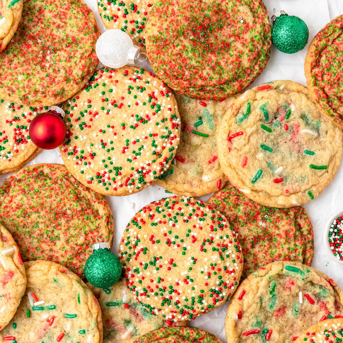 close up shot of christmas sugar cookies with sprinkles.