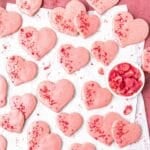 close up of heart shaped strawberry shortbread cookies.