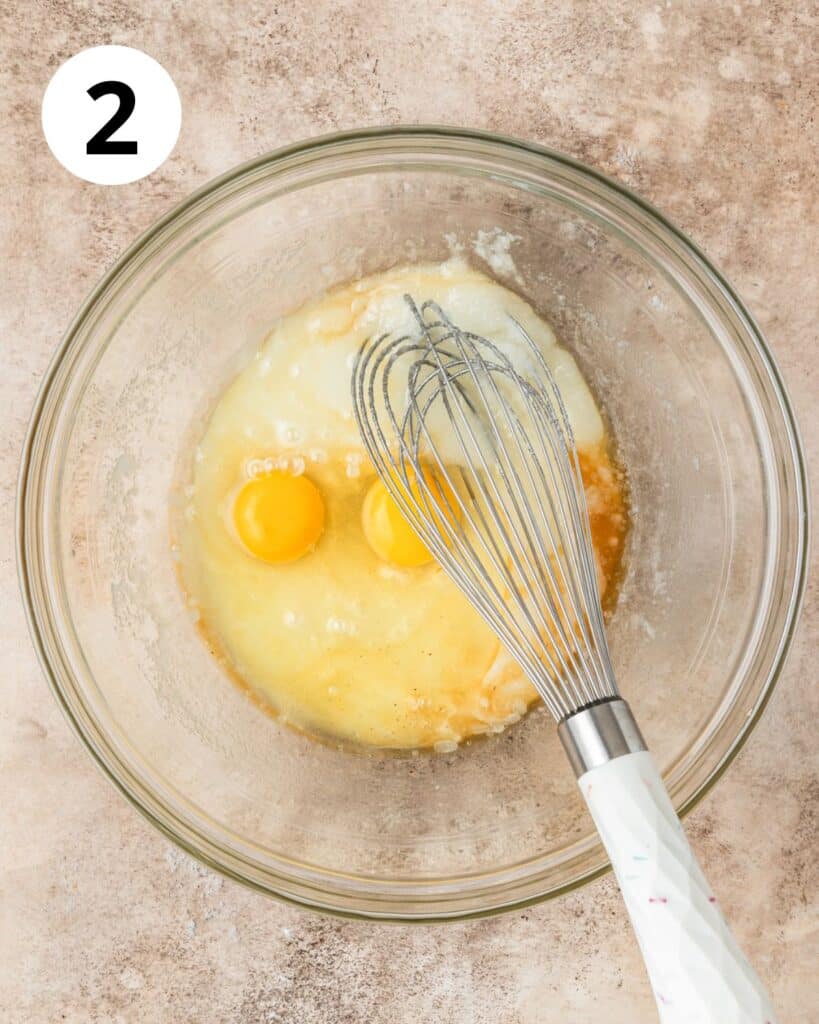 adding eggs and vanilla to batter.