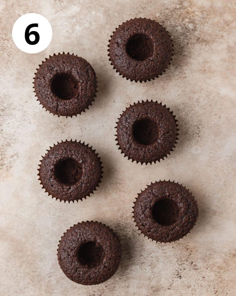 chocolate cupcakes with middle removed.