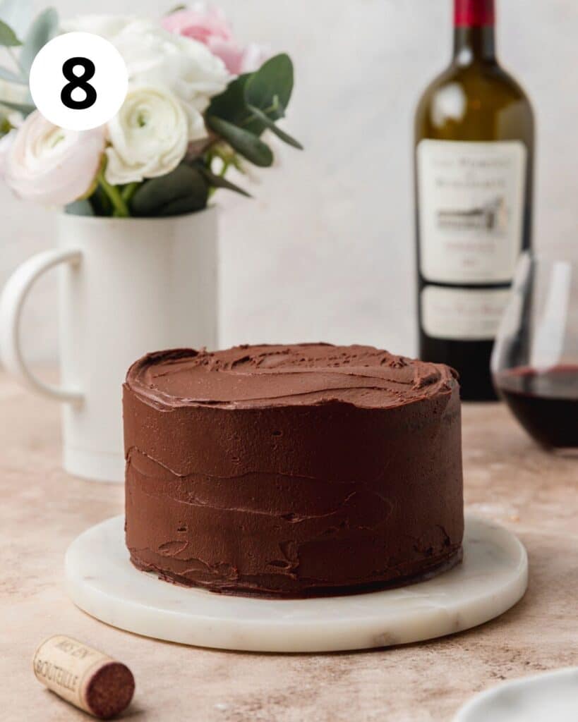 covering chocolate cake with red wine chocolate ganache.