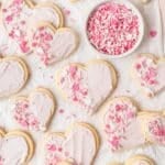 close up of frosted sugar cookies shaped like hearts.