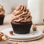 chocolate hazelnut cupcakes with nutella buttercream and crushed hazelnuts.