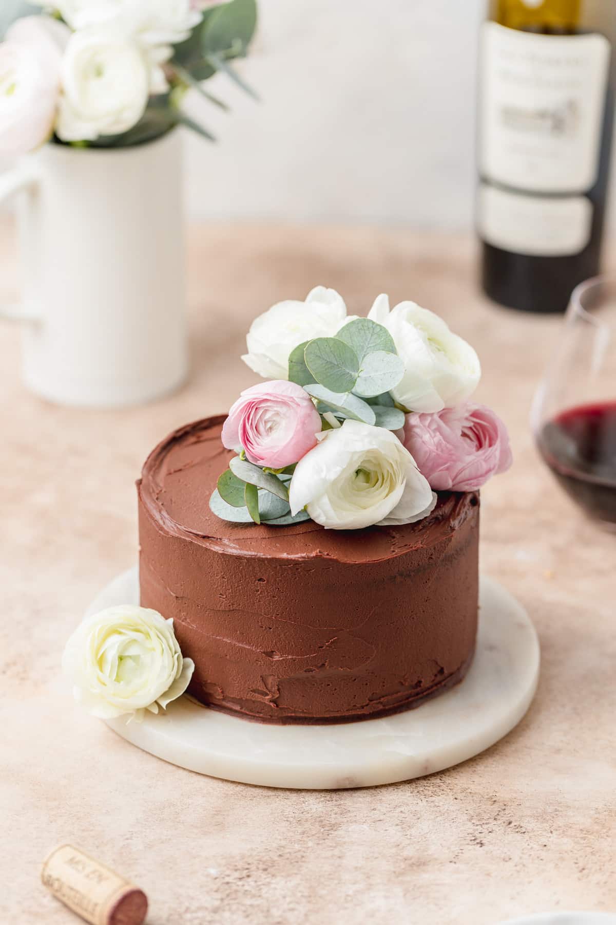 red wine chocolate cake decorated with flowers.