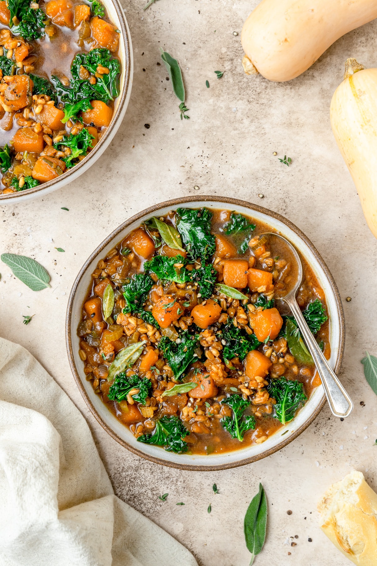 two bowls of butternut squash barley soup.