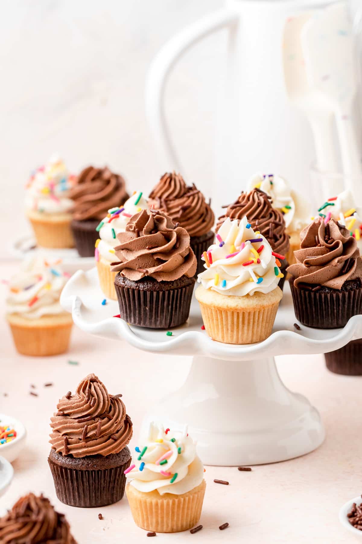 cake stand with mini cupcakes (both chocolate and vanilla).