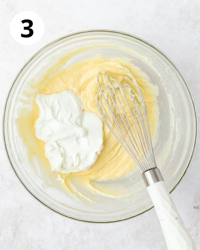 adding sour cream to batter.