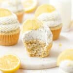 close up shot of lemon poppy seed cupcakes with cream cheese frosting.