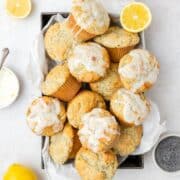 close up shot of lemon poppy seed muffins with lemon glaze.