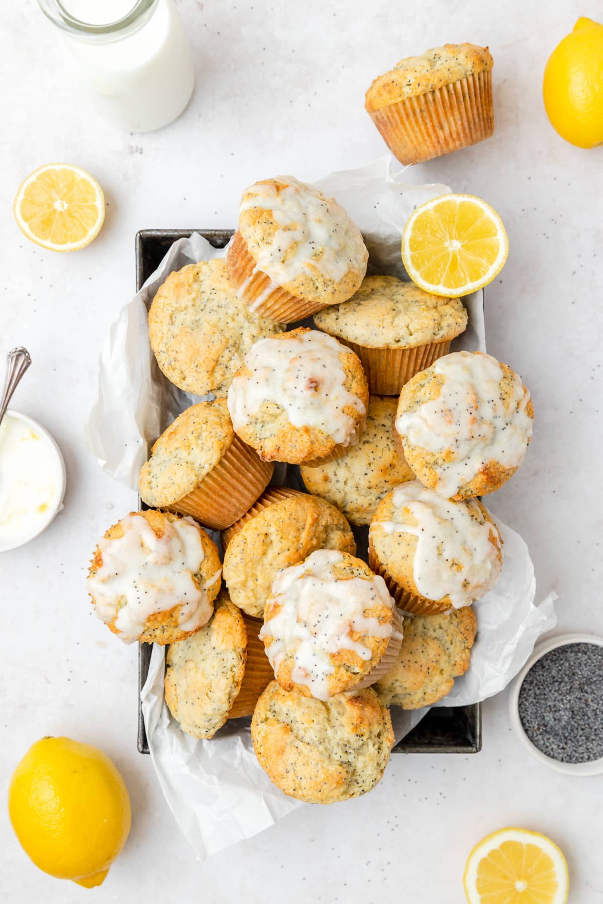 tray of lemon poppy seed muffins with lemon glaze.