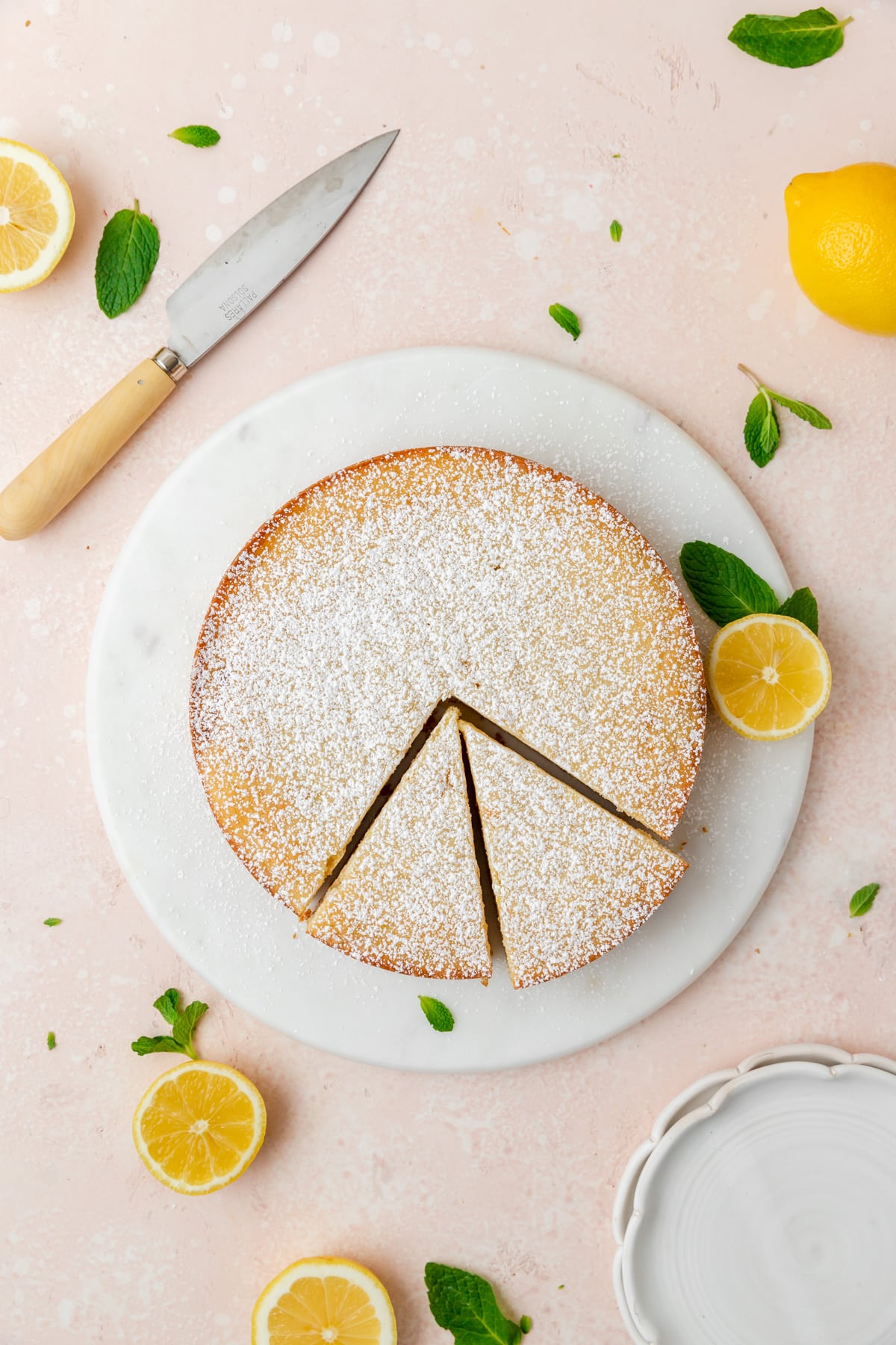 lemon ricotta cake topped with powdered sugar.