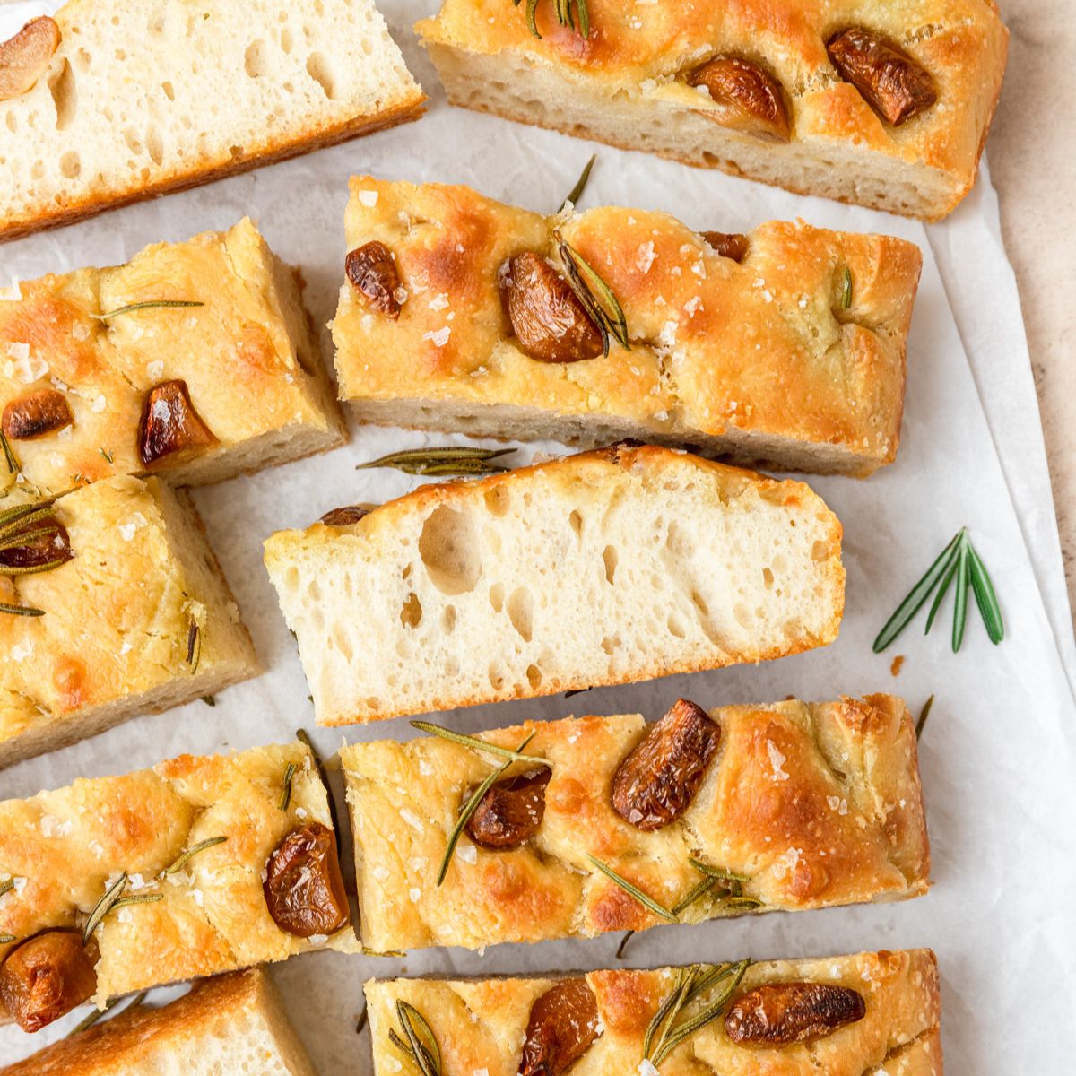 close up shot of sourdough focaccia with roasted garlic.