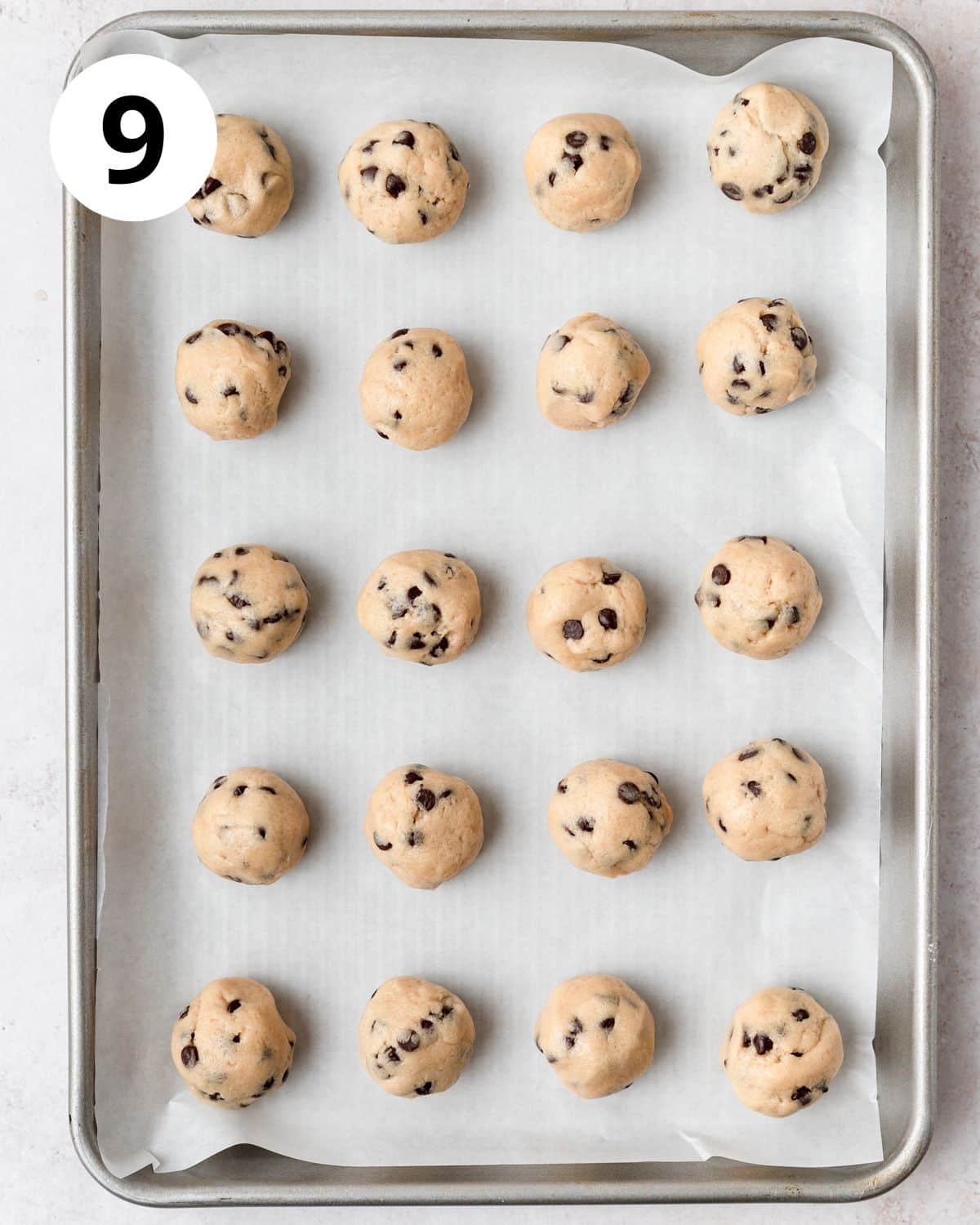 rolling edible cookie dough into small balls.