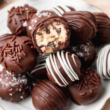 close up shot of chocolate covered cookie dough bites.