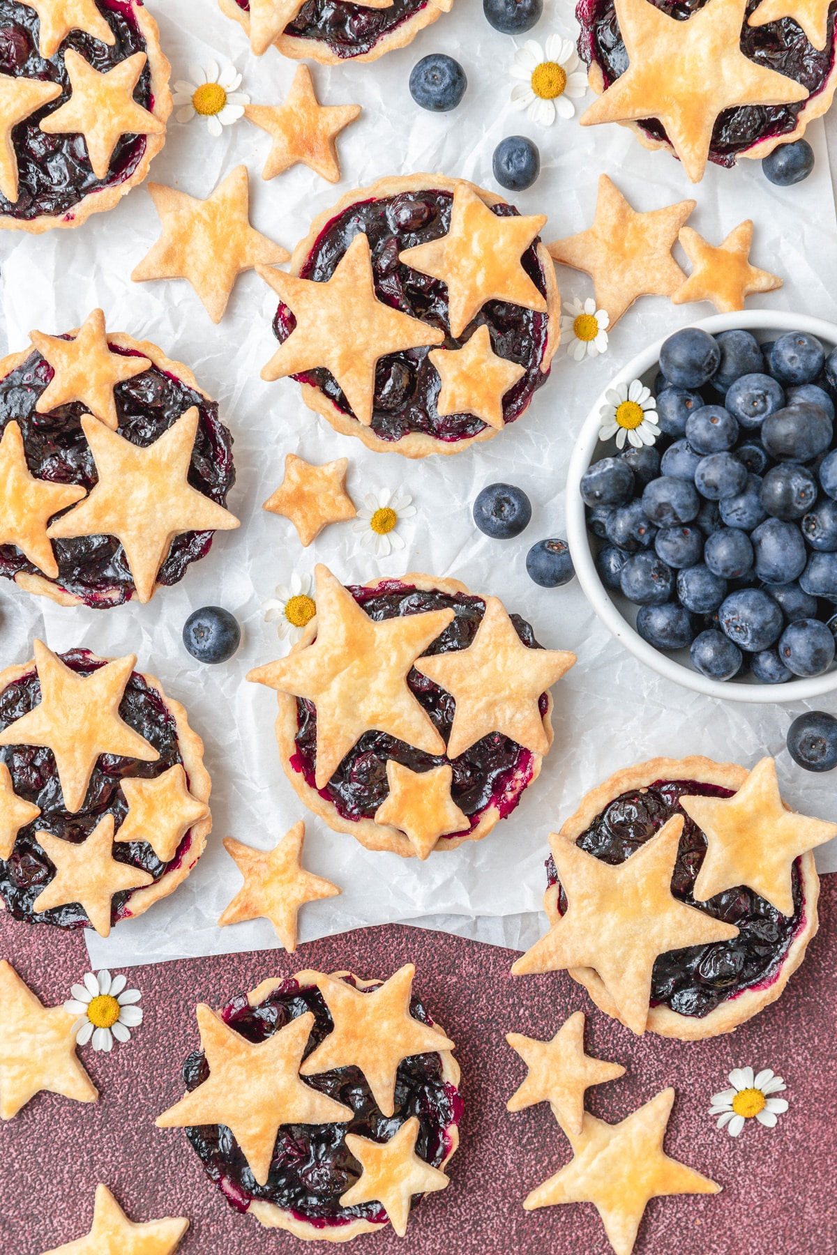 mini blueberry pies with star pie crust cutouts.