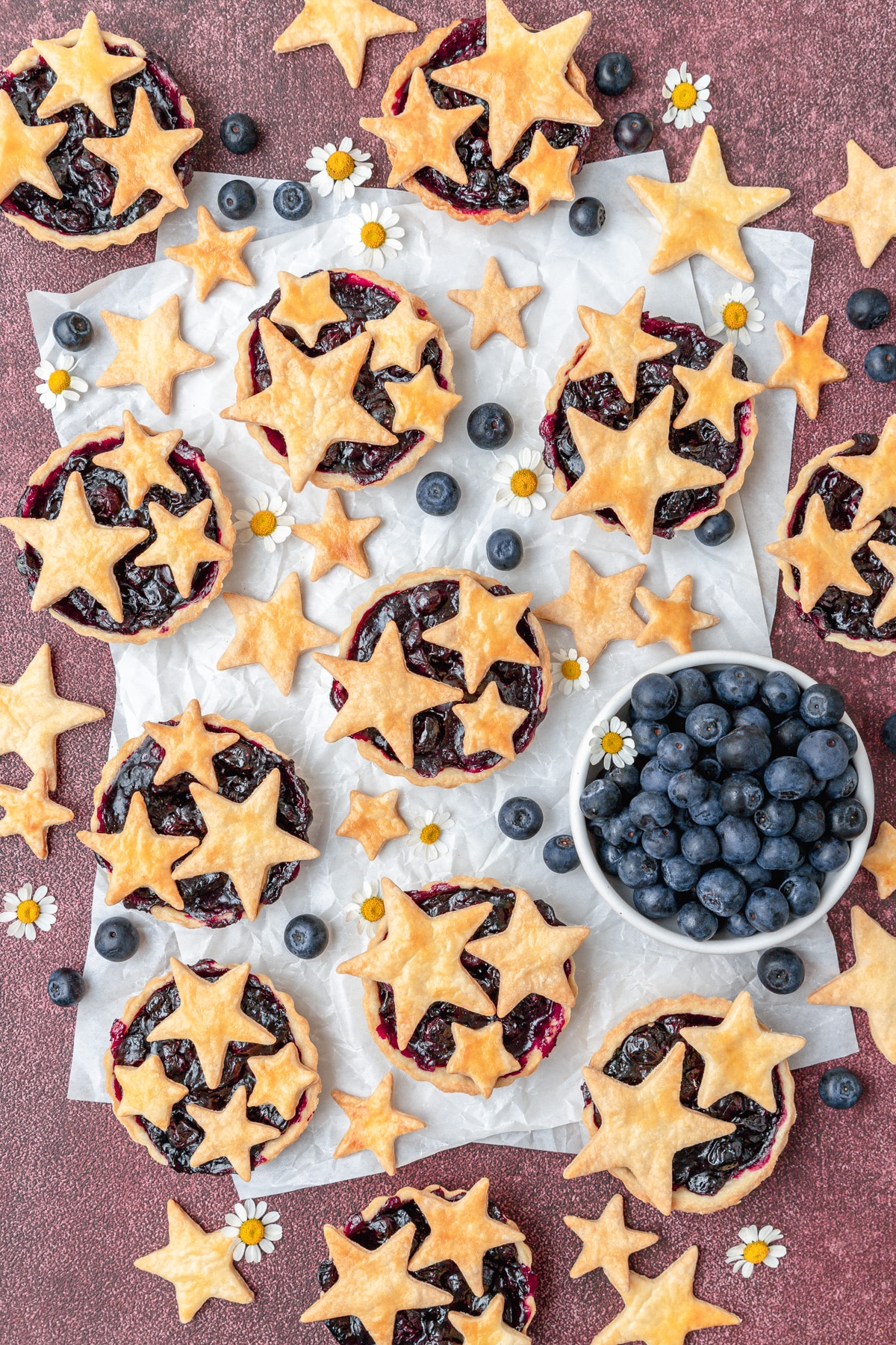 mini blueberry pie tarts with pie crust stars.