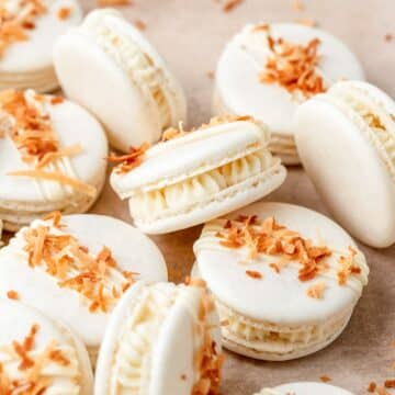 close up shot of toasted coconut macarons with white chocolate.