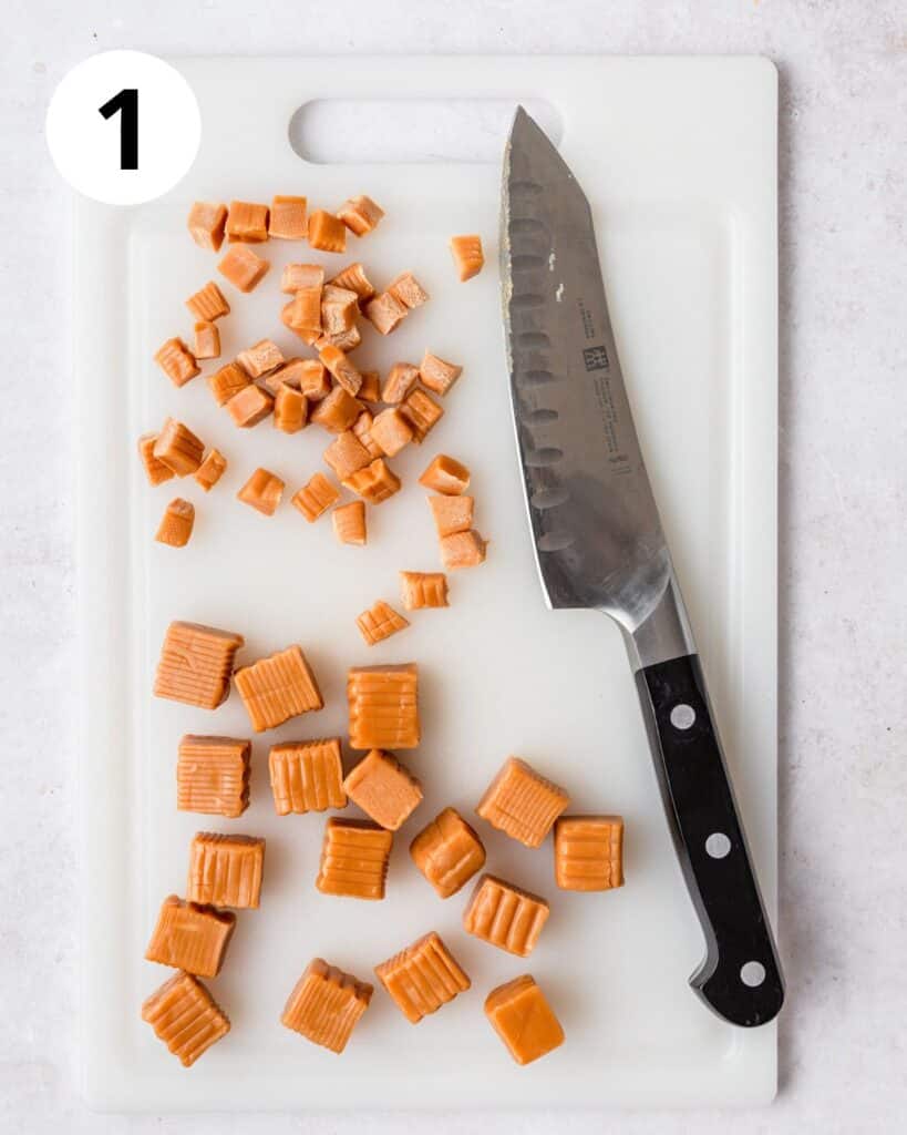 cutting caramels into small pieces.