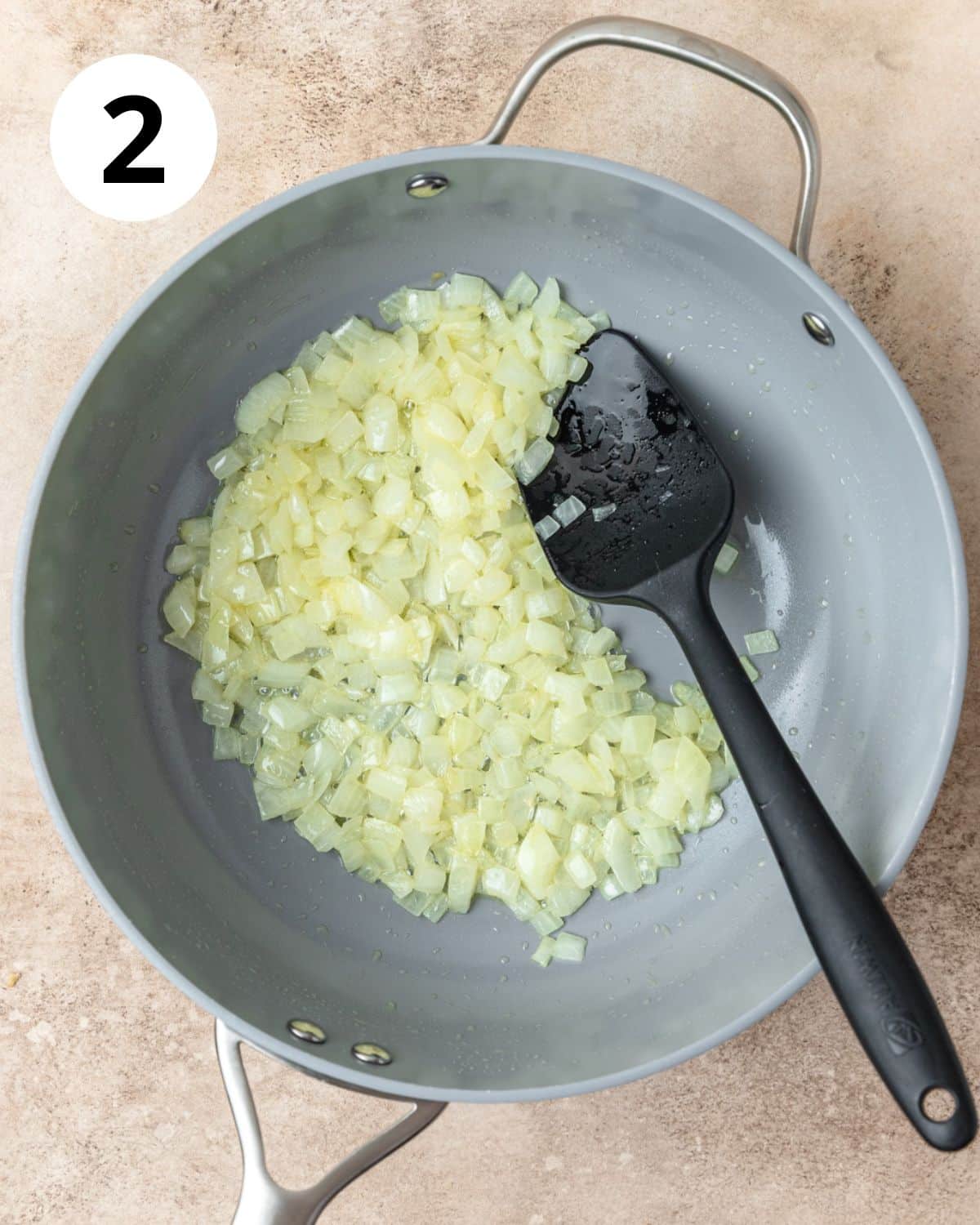 sautéing onion and garlic in pan.
