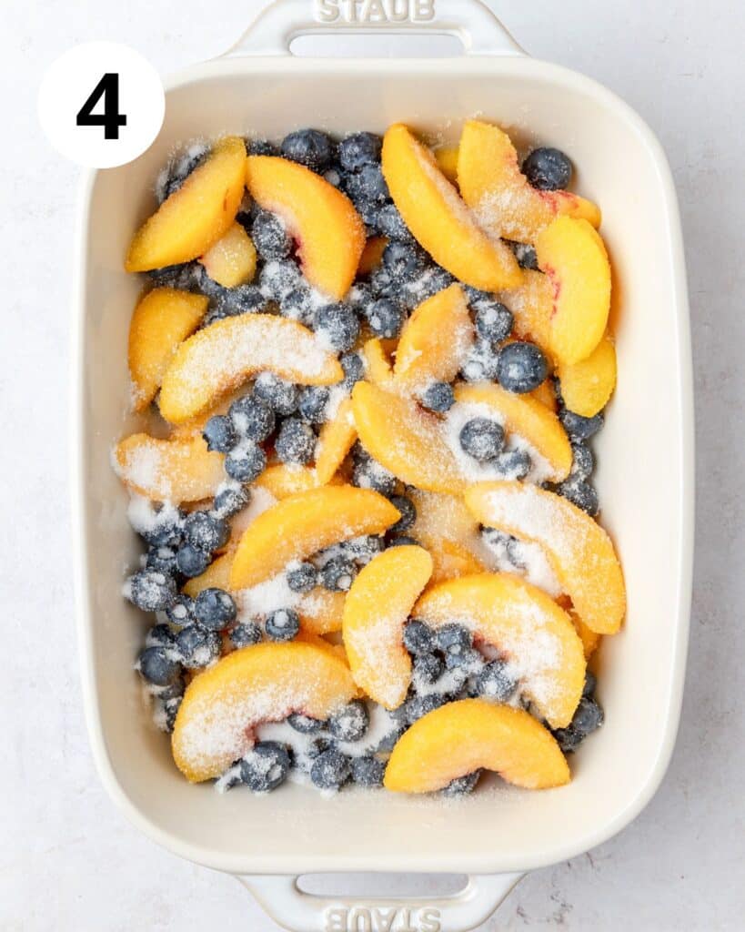 tossing peaches and blueberries with sugar and cornstarch.