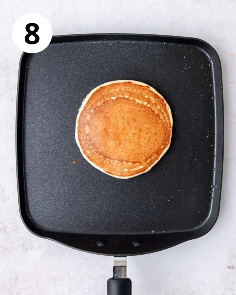 golden brown sourdough pancake on griddle.