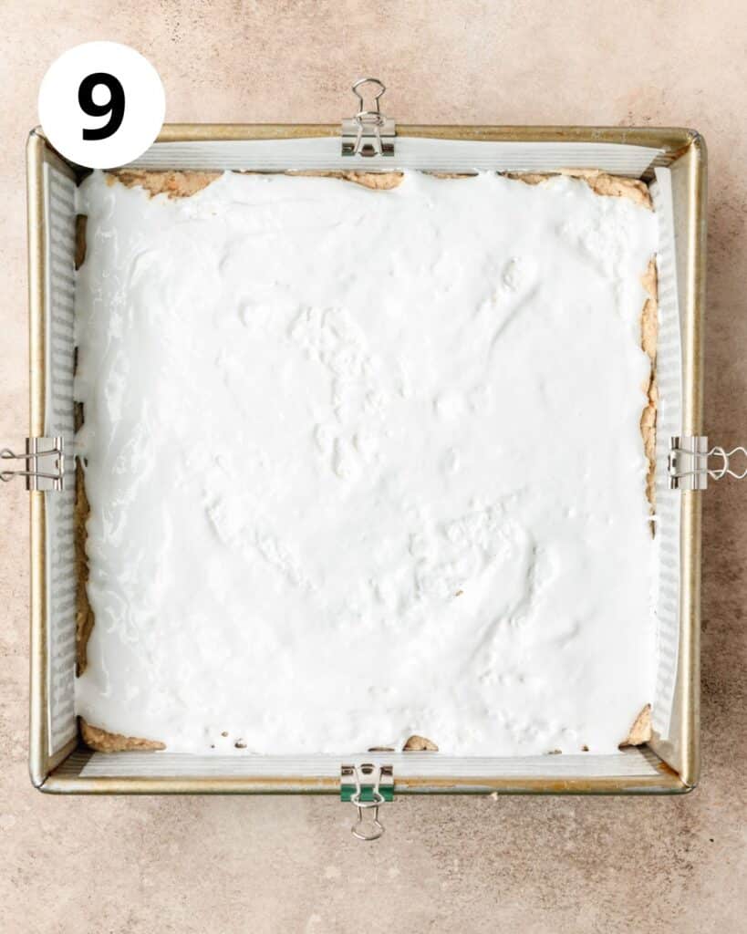spreading marshmallow fluff into even layer.