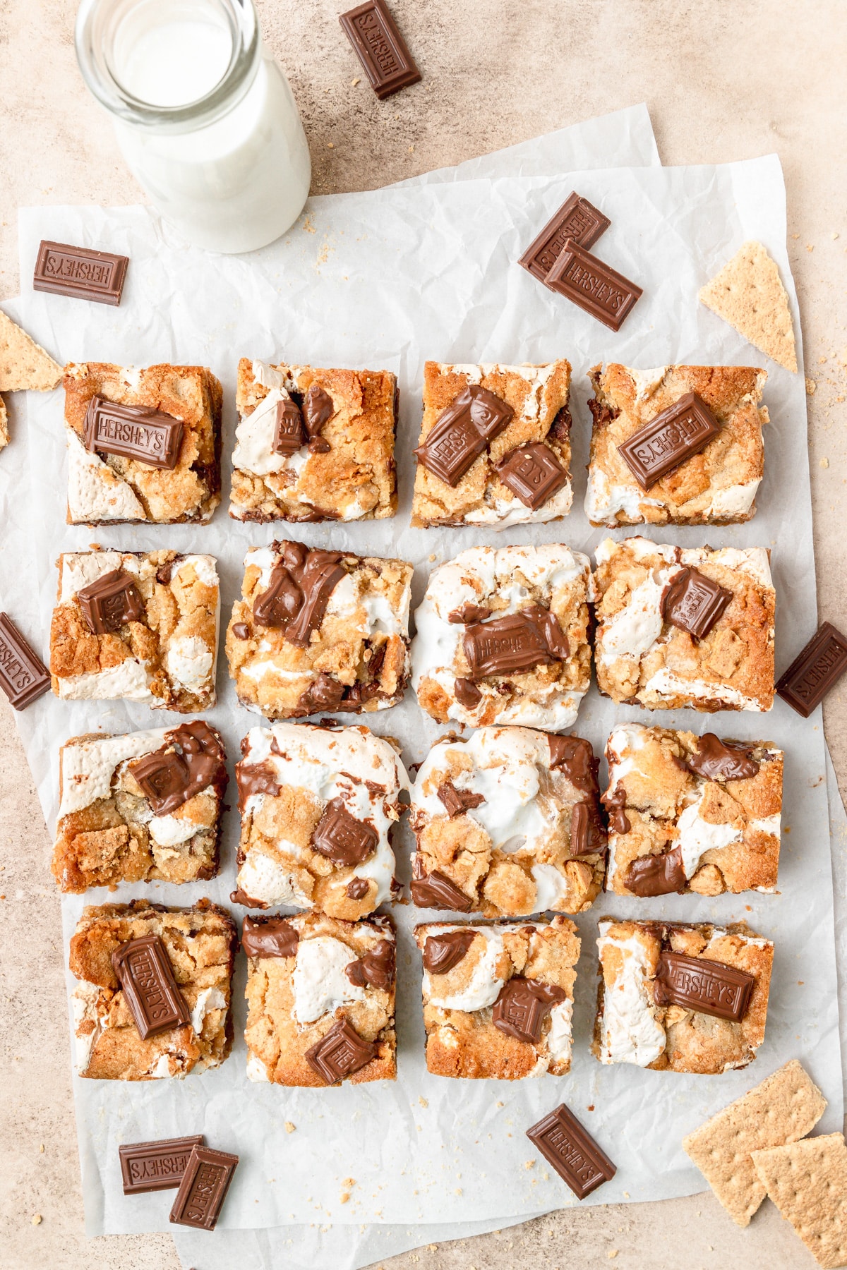 s'mores cookie bars topped with chocolate bars.