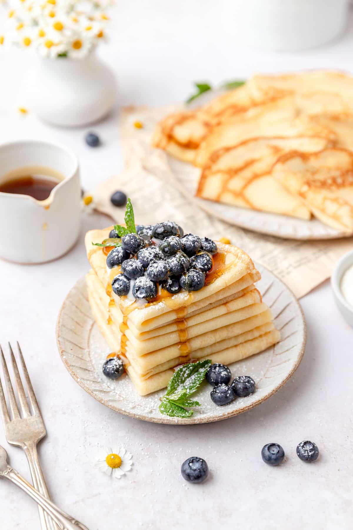stack of sourdough crepes with blueberries.