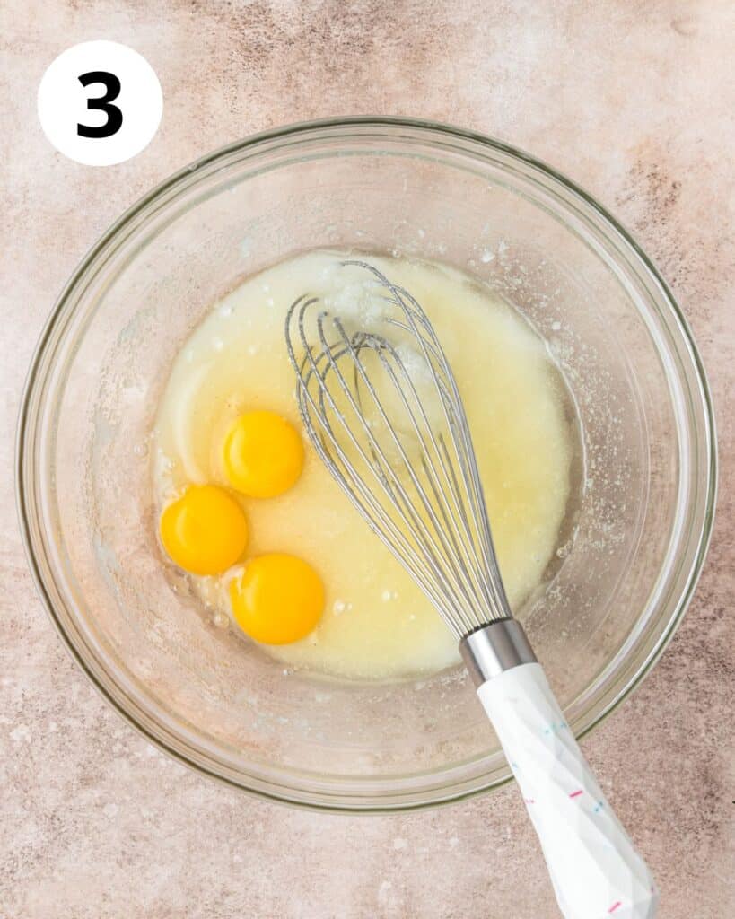 adding eggs to cake batter.