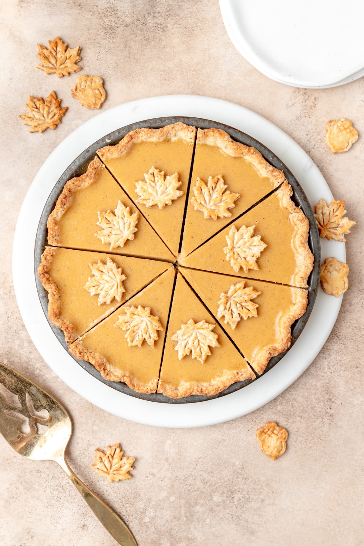 maple cream pie with maple leaf pie crust cutouts.