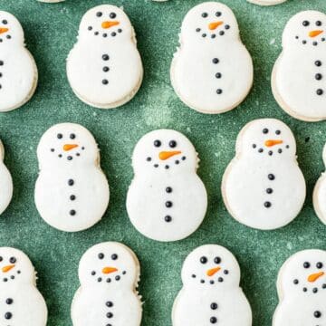 snowman shaped macarons with eggnog buttercream.