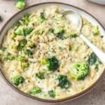 close up of creamy broccoli cheddar orzo.