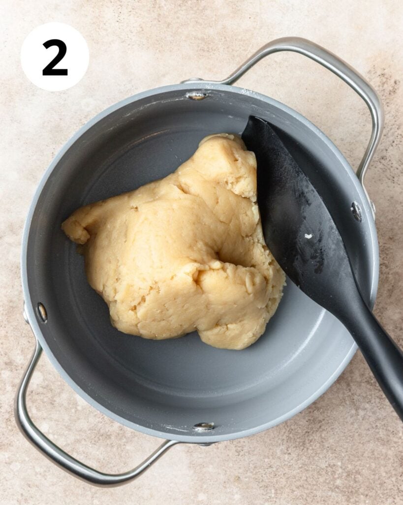 adding flour to water and butter.