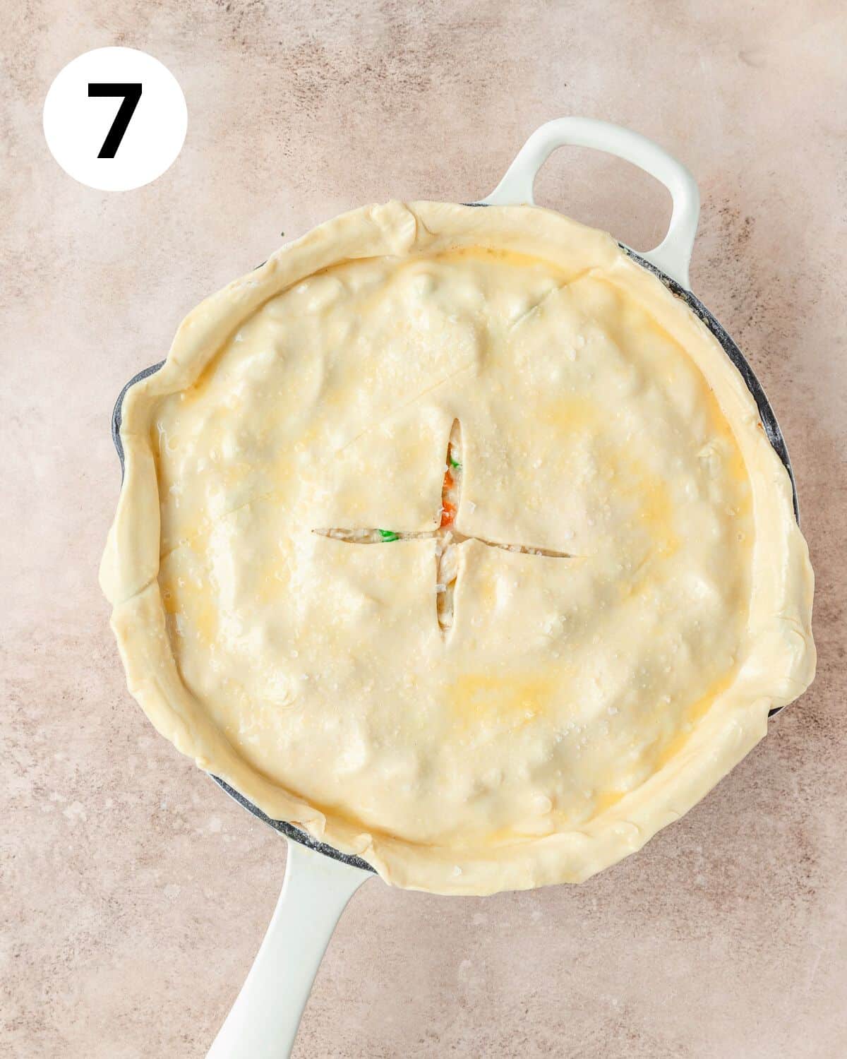 topping pot pie with puff pastry brushed with egg wash.