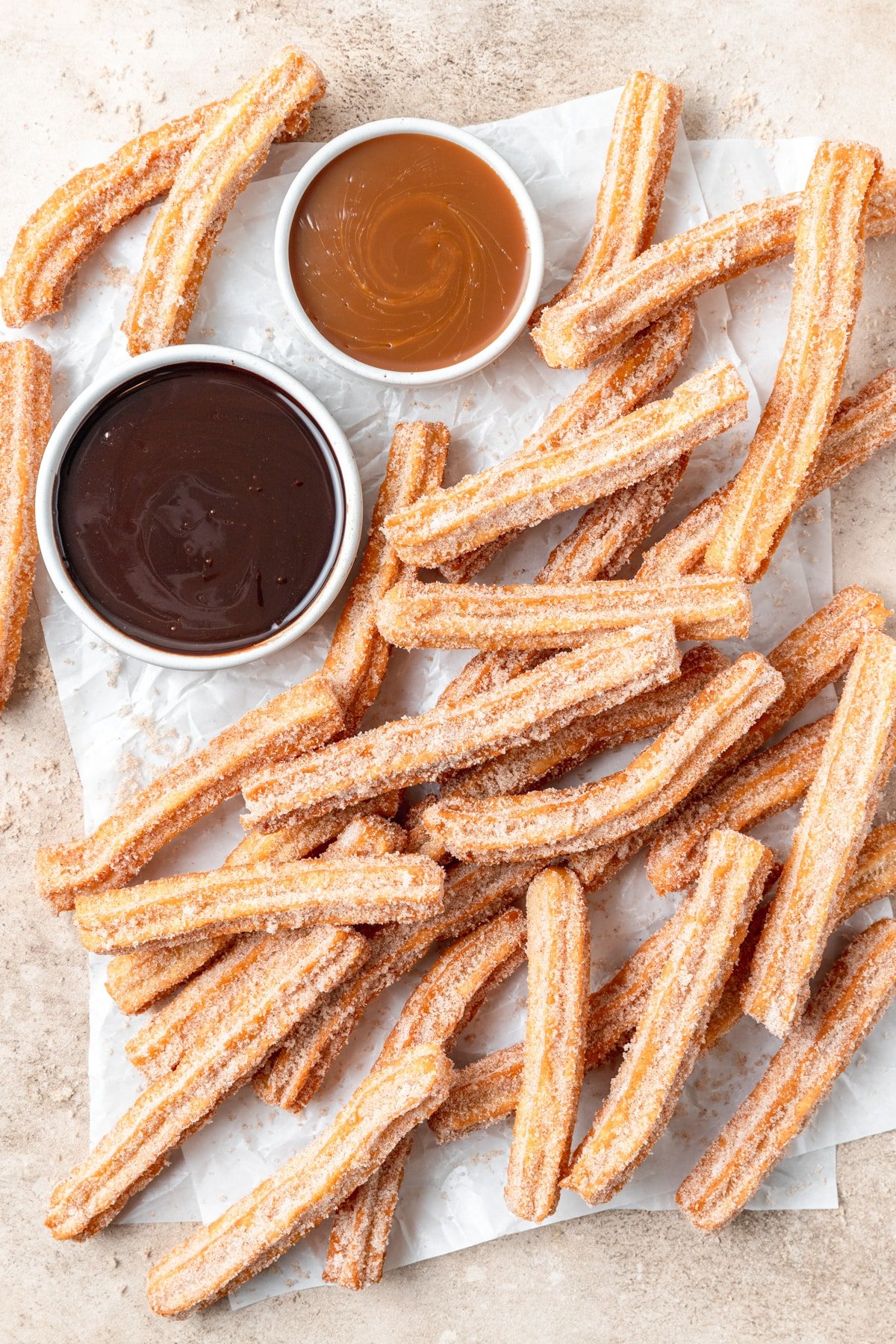 homemade churros with chocolate and caramel.