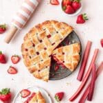 close up of strawberry rhubarb pie with lattice crust.