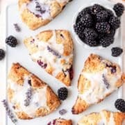 close up of blackberry lavender scones with lemon lavender glaze.