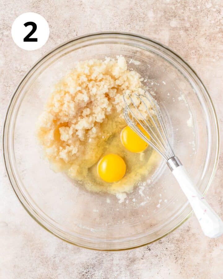 adding eggs to batter.