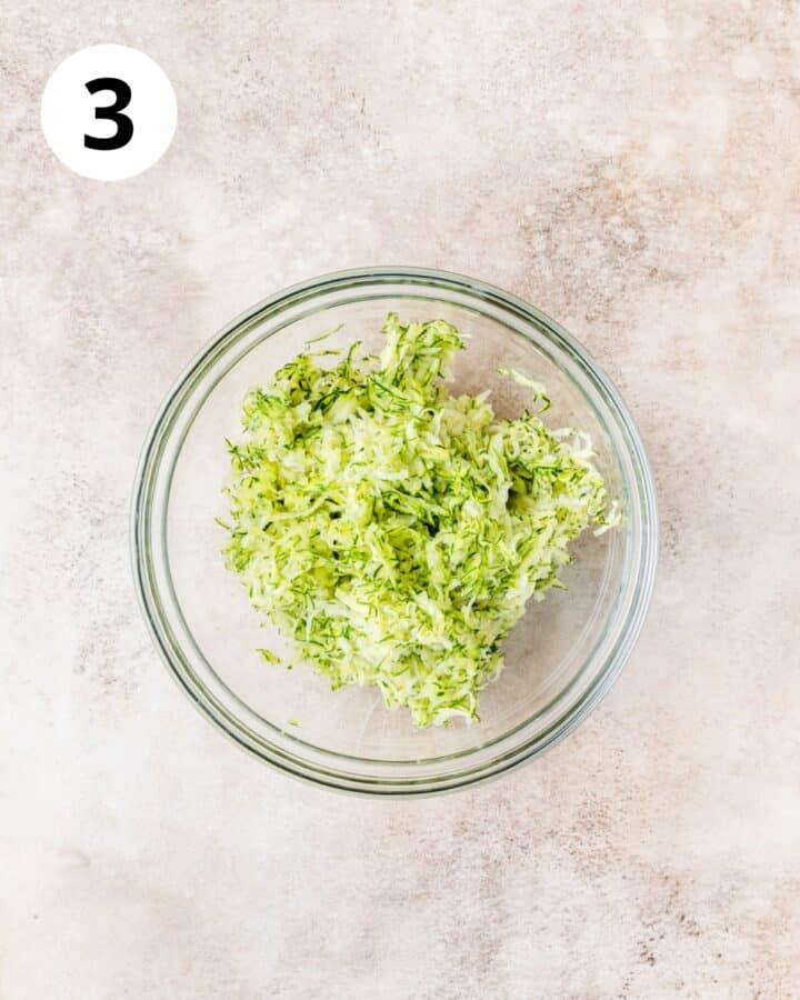 shredded zucchini in bowl.