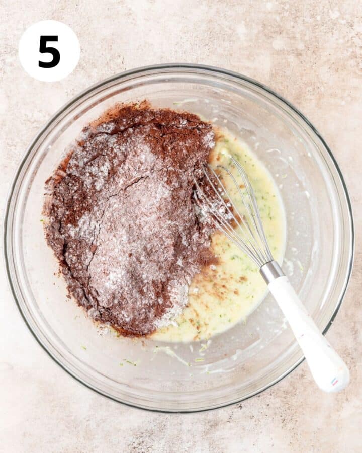 adding dry ingredients to muffins.