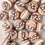 hot chocolate macarons with chocolate ganache and swiss meringue.