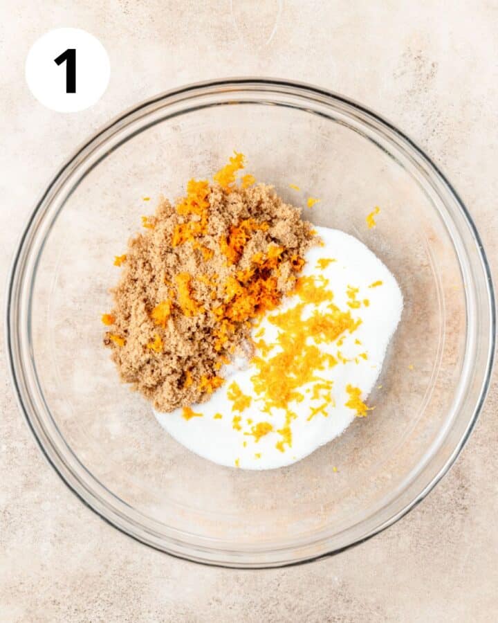 adding orange zest to sugars. 